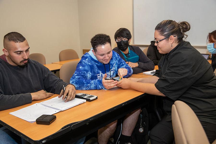 San Juan College students working on math problems together